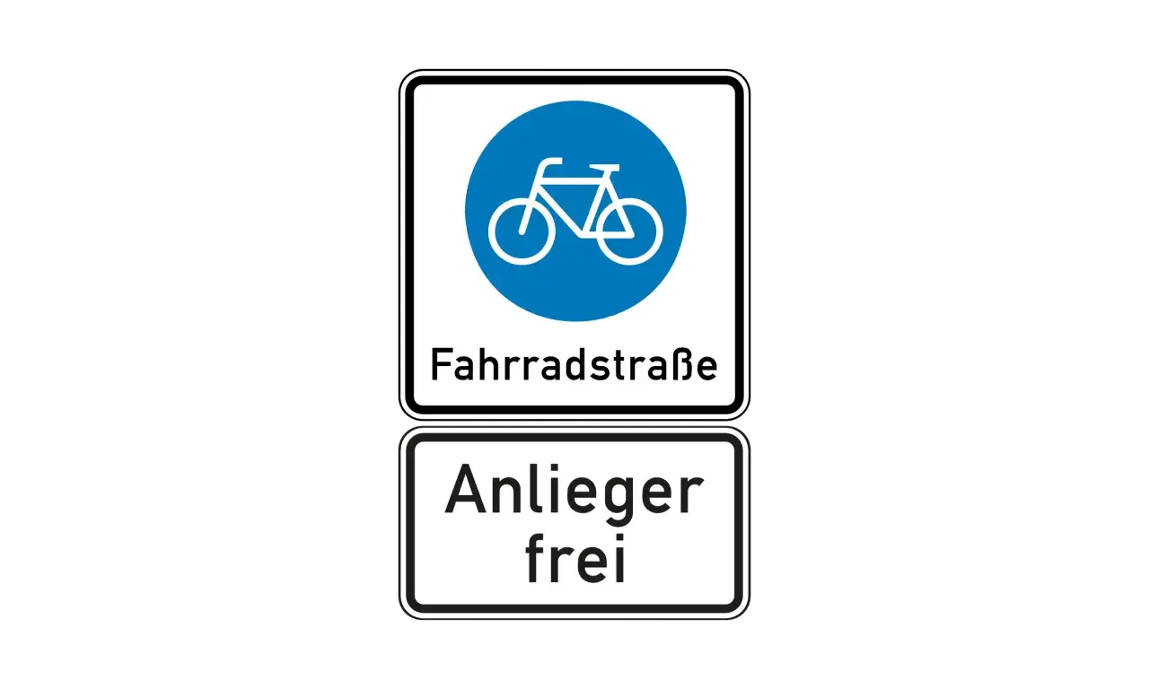 Verkehrsschild: Fahrradstraße, Anlieger frei. Hier dürfen Radfahrer fahren und Anwohner mit ihrem Auto durch.